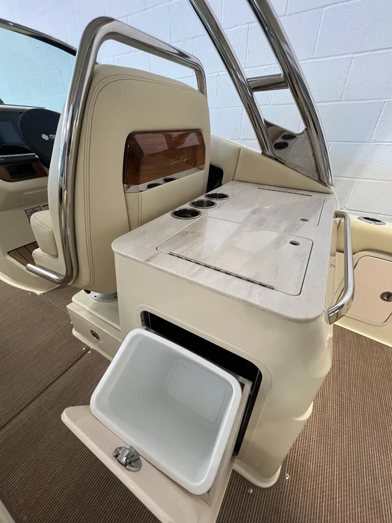 Slide: The Image of 2024 Chris-Craft Calypso 28 interior with built-in cooler and storage. - 41