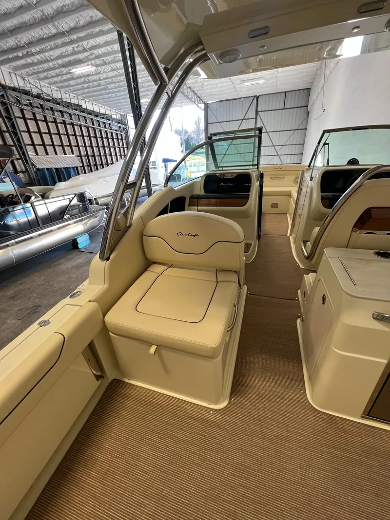 Slide: The Image of 2024 Chris-Craft Calypso 28 boat interior with beige seating and modern design. - 42
