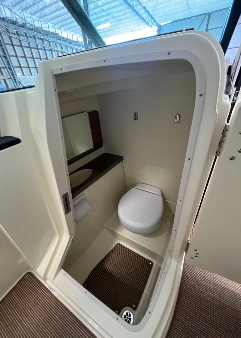 Slide: The Image of 2024 Chris-Craft Calypso 28 boat interior bathroom with toilet and sink. - 44