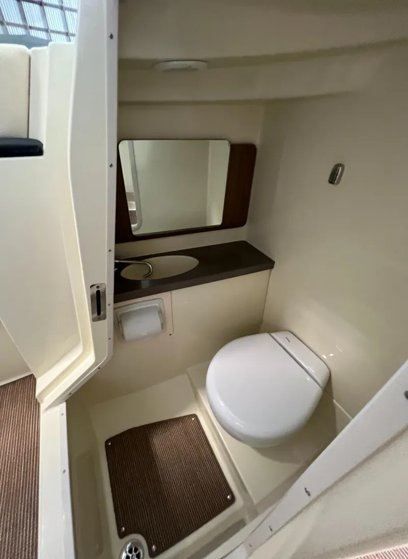 Slide: The Image of 2024 Chris-Craft Calypso 28 boat interior bathroom with toilet and sink. - 45