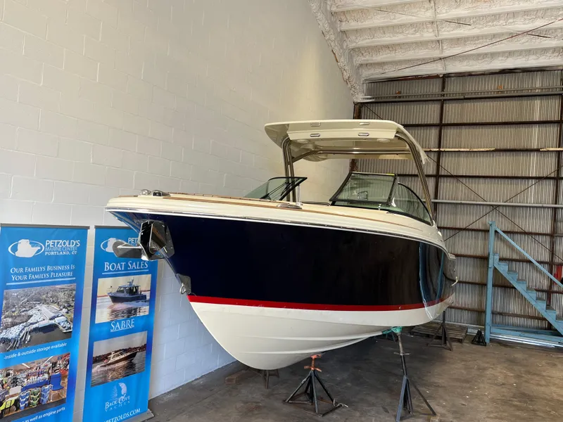 Slide: The Image of 2024 Chris-Craft Calypso 28 boat in indoor storage facility. - 8