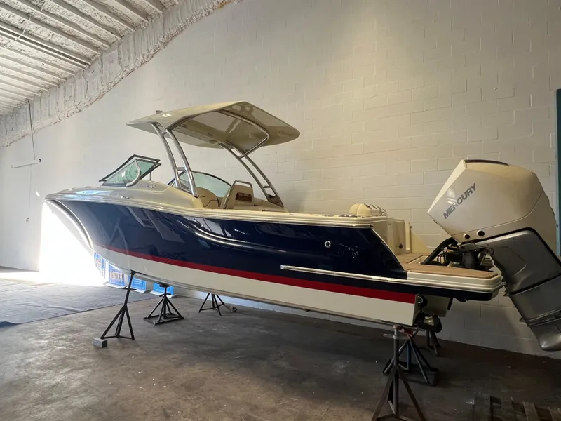 Slide: The Image of 2024 Chris-Craft Calypso 28 boat in storage, side view. - 9