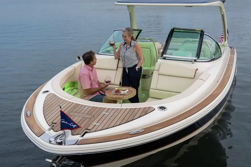 Slide: The Image of Manufacturer Provided Image: 2025 Chris-Craft Launch 31 GT boat with people enjoying drinks on deck. - 2