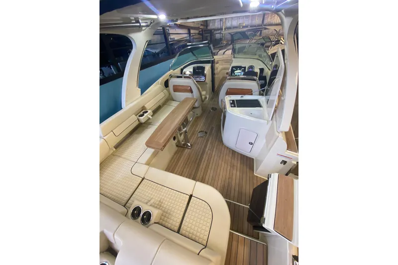 Slide: The Image of Luxurious interior of 2026 Chris-Craft Launch 31 GT boat with elegant seating and wood accents. - 5