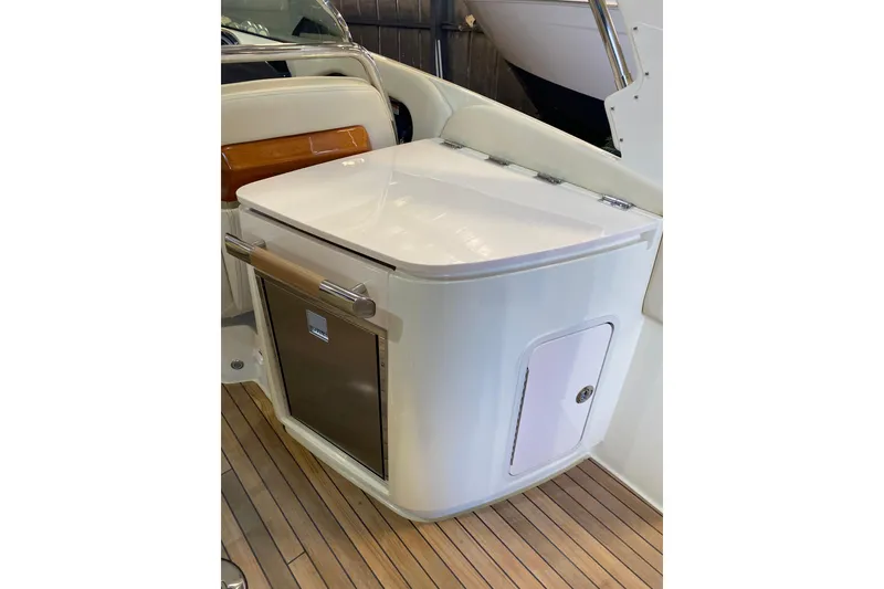 Slide: The Image of 2026 Chris-Craft Launch 31 GT interior with sleek cabinetry and wood accents. - 7