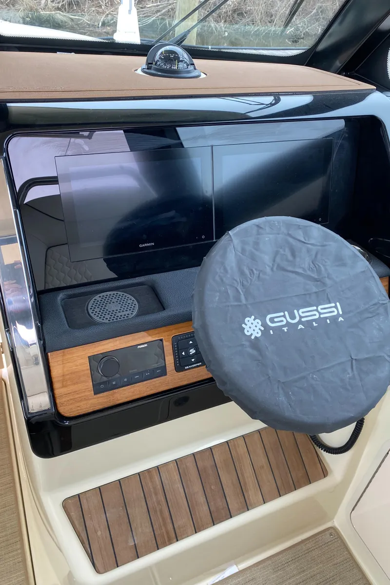 Slide: The Image of 2024 Chris-Craft Calypso 32 helm with Gussi Italia steering wheel cover. - 13