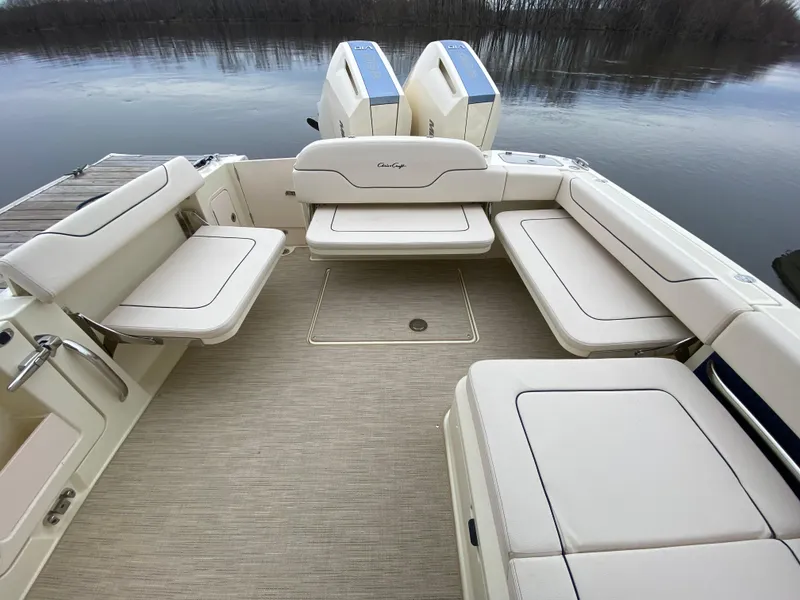 Slide: The Image of 2024 Chris-Craft Calypso 32 boat with spacious seating and twin outboard engines. - 5