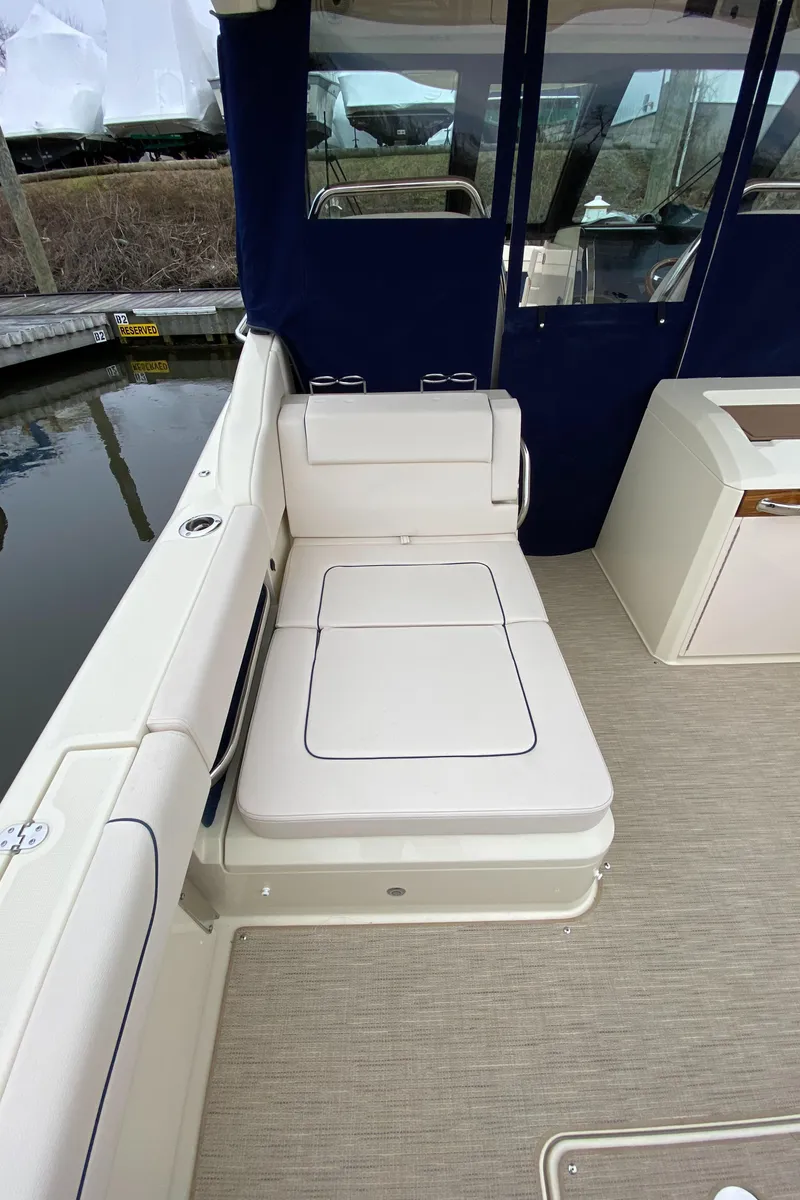 Slide: The Image of 2024 Chris-Craft Calypso 32 boat interior seating area. - 8