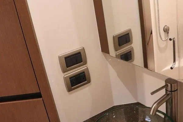 Slide: The Image of Luxurious cabin interior of 2016 Sea Ray 400 Sundancer with cozy bedding. - 10