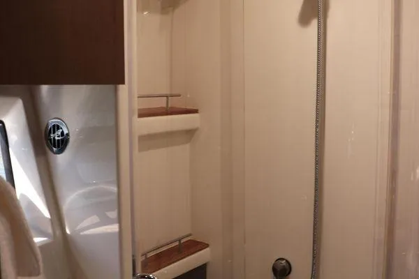 Slide: The Image of Luxurious interior of 2016 Sea Ray Sundancer 400 yacht with elegant seating and scenic view. - 13