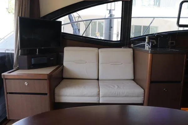 Slide: The Image of Interior view of 2016 Sea Ray Sundancer 400 yacht, featuring sleek wood cabinetry and modern design. - 24