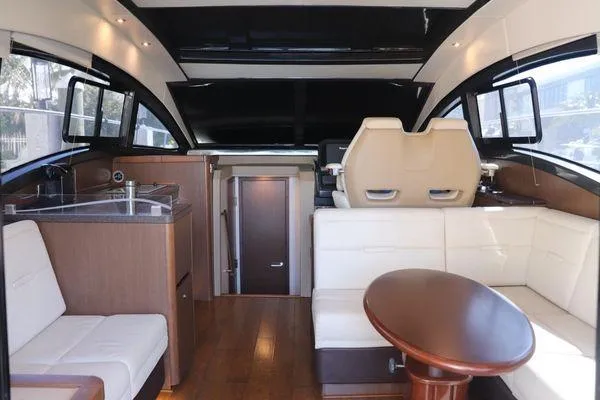 Slide: The Image of Interior of 2016 Sea Ray Sundancer 400 yacht with plush seating and modern controls. - 25