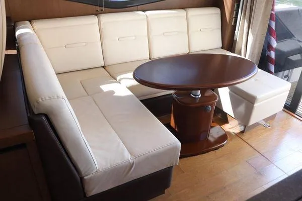 Slide: The Image of 2016 Sea Ray Sundancer 400 helm with modern controls and navigation systems. - 26