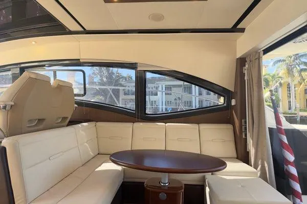 Slide: The Image of Interior of 2016 Sea Ray Sundancer 400 yacht, featuring helm and galley area. - 31