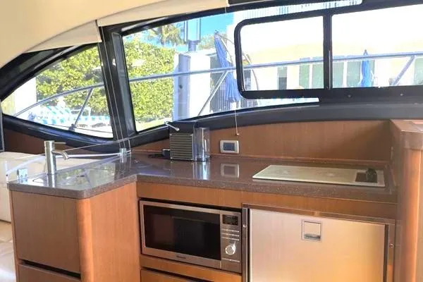 Slide: The Image of 2016 Sea Ray Sundancer 400 helm with modern controls and comfortable seating. - 34