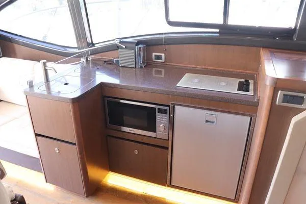Slide: The Image of Bathroom interior of 2016 Sea Ray Sundancer 400 yacht with modern sink and fixtures. - 35
