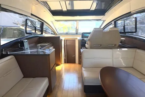 Slide: The Image of 2016 Sea Ray Sundancer 400 yacht with black cover docked at marina. - 39