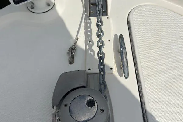 Slide: The Image of Engine compartment of a 2016 Sea Ray Sundancer 400 with visible hoses and wiring. - 46