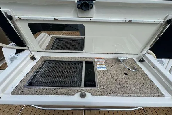 Slide: The Image of Close-up of a 2016 Sea Ray Sundancer 400 engine components. - 48