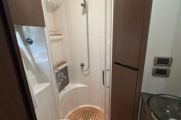 Slide: The Image of Glass sink and faucet on a Sea Ray 400 Sundancer 2016 yacht bathroom counter. - 5