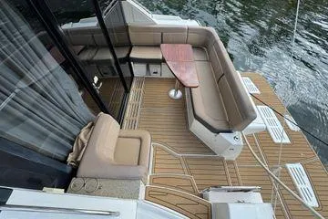 Slide: The Image of Engine compartment of a 2016 Sea Ray Sundancer 400 boat, showcasing detailed mechanical components. - 51