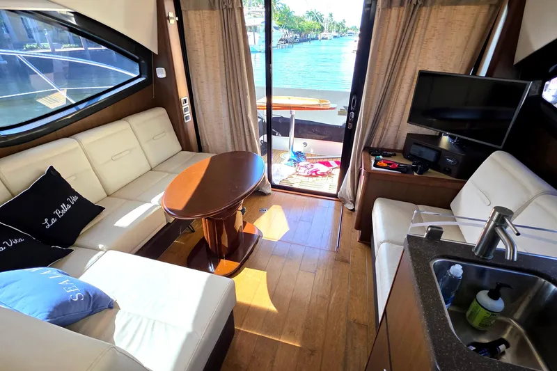 Slide: The Image of Interior of 2016 Sea Ray Sundancer 400 yacht with elegant seating and water view. - 55