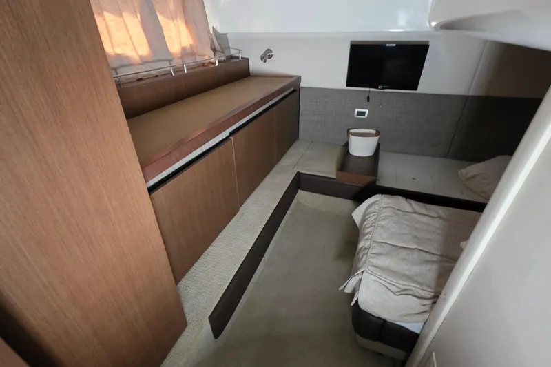 Slide: The Image of Interior cabin of 2016 Sea Ray Sundancer 400 yacht with bed and TV. - 58