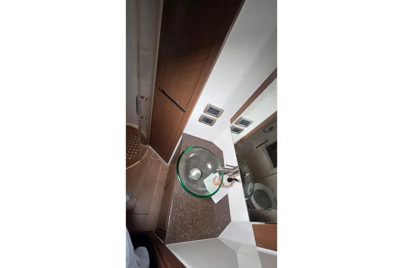 Slide: The Image of Bathroom interior of 2016 Sea Ray Sundancer 400 yacht with glass sink and modern fixtures. - 60