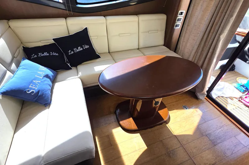 Slide: The Image of Luxurious 2016 Sea Ray Sundancer 400 interior with elegant seating and stylish wooden table. - 66