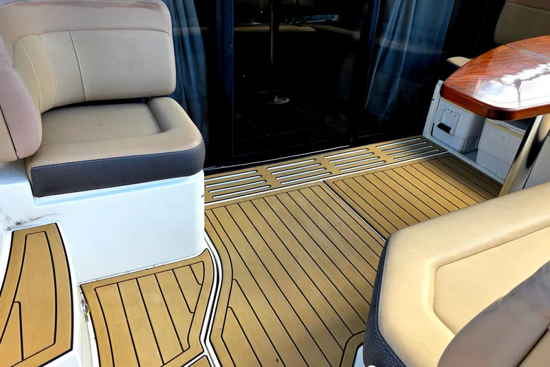 Slide: The Image of Luxurious interior of 2016 Sea Ray Sundancer 400 yacht with elegant seating and wood flooring. - 70