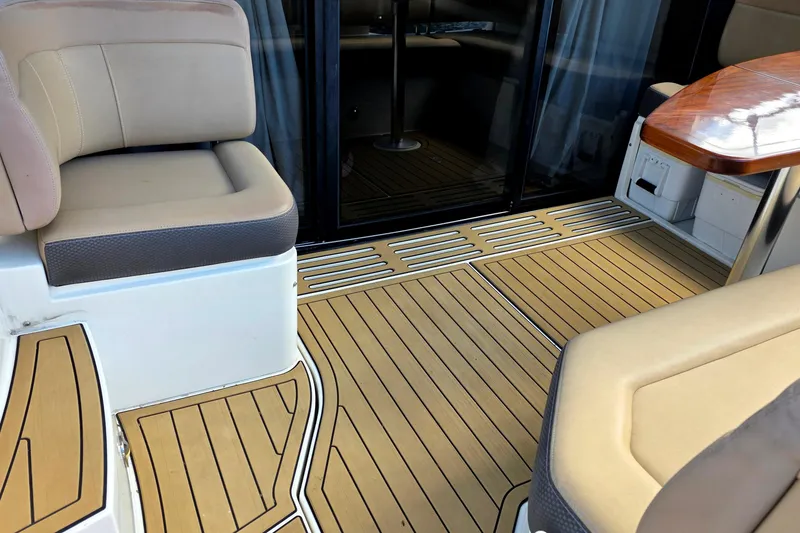 Slide: The Image of Interior seating area of 2016 Sea Ray Sundancer 400 yacht with wood flooring. - 73