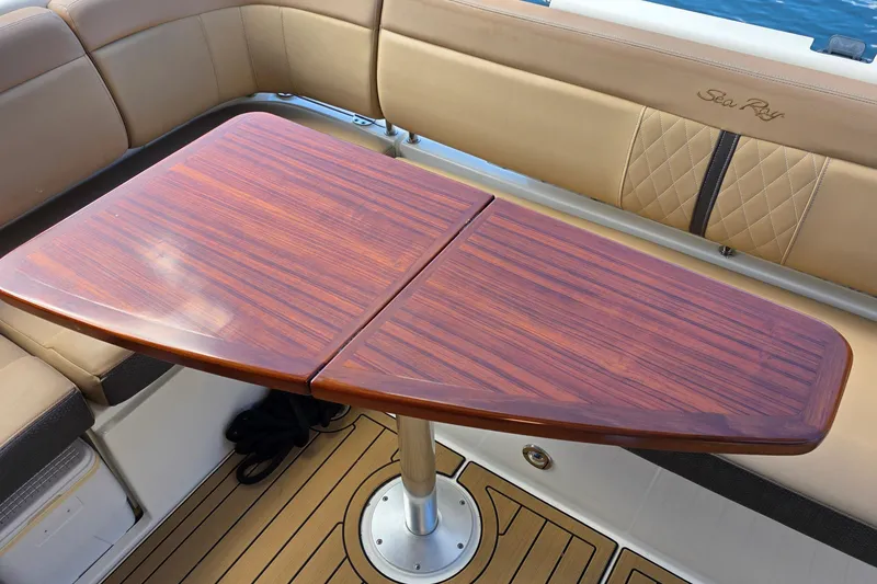 Slide: The Image of Luxurious interior of 2016 Sea Ray Sundancer 400 with elegant wooden table and seating. - 79