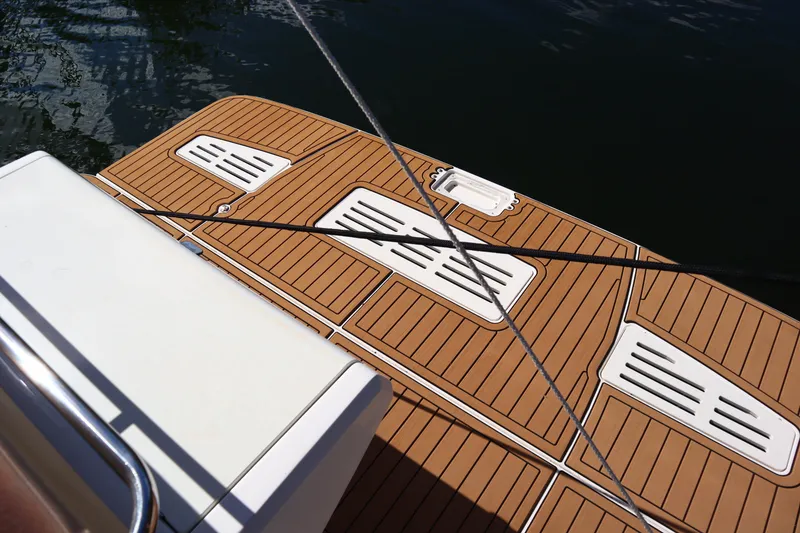 Slide: The Image of 2016 Sea Ray Sundancer 400 swim platform with teak decking and mooring lines. - 83