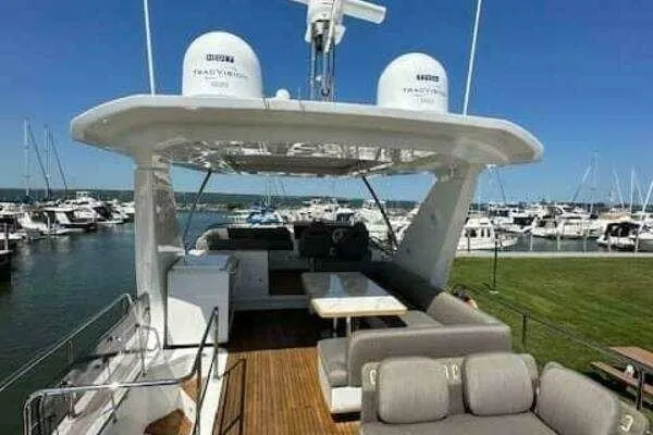 Slide: The Image of Luxury 2020 Azimut 66 yacht with spacious deck and marina view. - 13