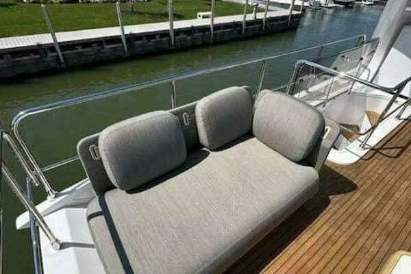 Slide: The Image of Luxurious seating area on 2020 Azimut 66 yacht deck, overlooking water. - 21