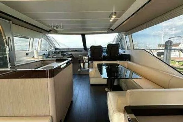 Slide: The Image of Luxurious interior of 2020 Azimut 66 yacht with modern seating and panoramic windows. - 28