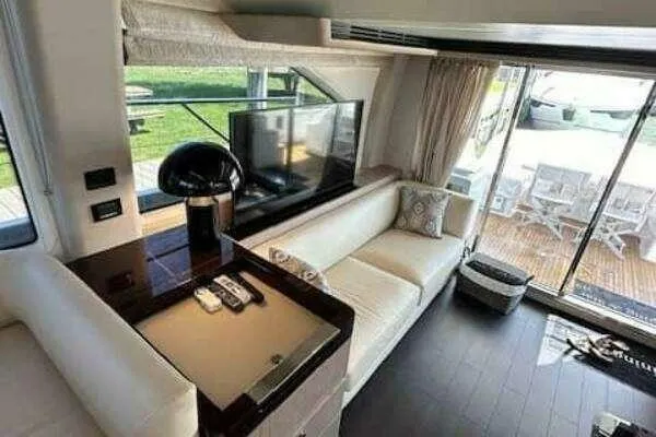 Slide: The Image of Luxurious interior of a 2020 Azimut 66 yacht with modern furnishings and large windows. - 32