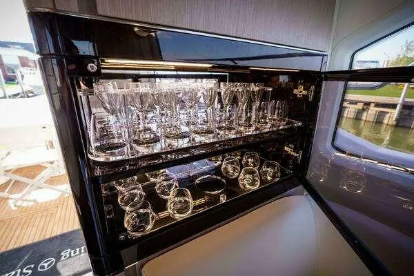 Slide: The Image of Luxurious glassware cabinet on a 2020 Azimut 66 yacht, showcasing elegant design and craftsmanship. - 33