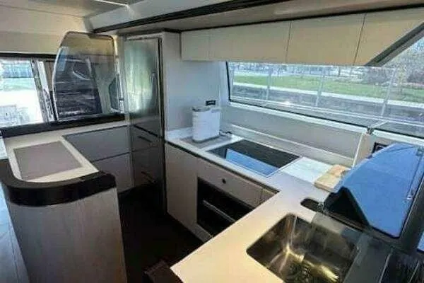 Slide: The Image of Modern kitchen interior of 2020 Azimut 66 yacht, featuring sleek design and appliances. - 34