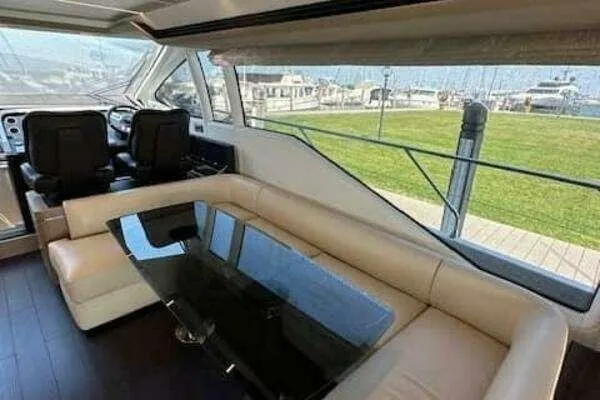 Slide: The Image of Luxurious interior of a 2020 Azimut 66 yacht with leather seating and glass table. - 38