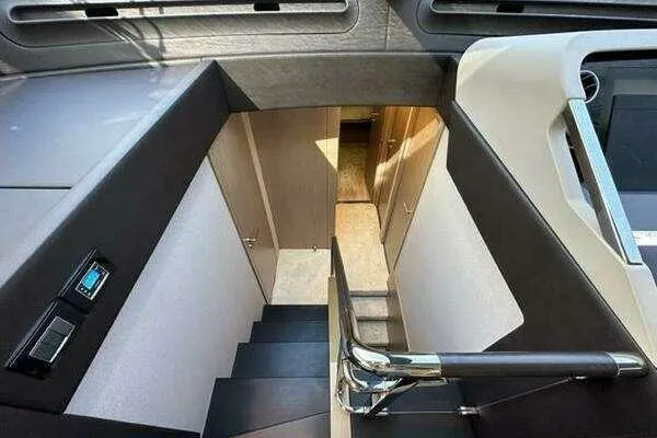 Slide: The Image of Interior staircase of 2020 Azimut 66 yacht, featuring modern design and sleek finishes. - 42