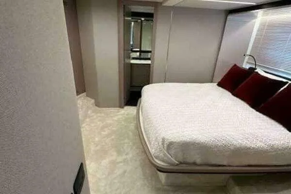 Slide: The Image of Luxurious bedroom interior of 2020 Azimut 66 yacht with plush bedding and modern design. - 44