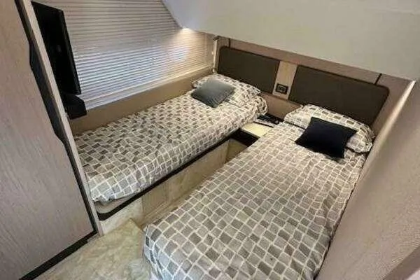 Slide: The Image of Interior of 2020 Azimut 66 yacht with twin beds and modern decor. - 51