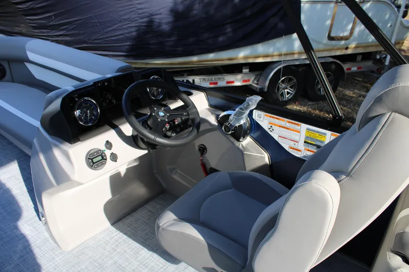 Slide: The Image of Interior of 2026 Premier 220 Sunscape RF boat with modern steering console. - 6
