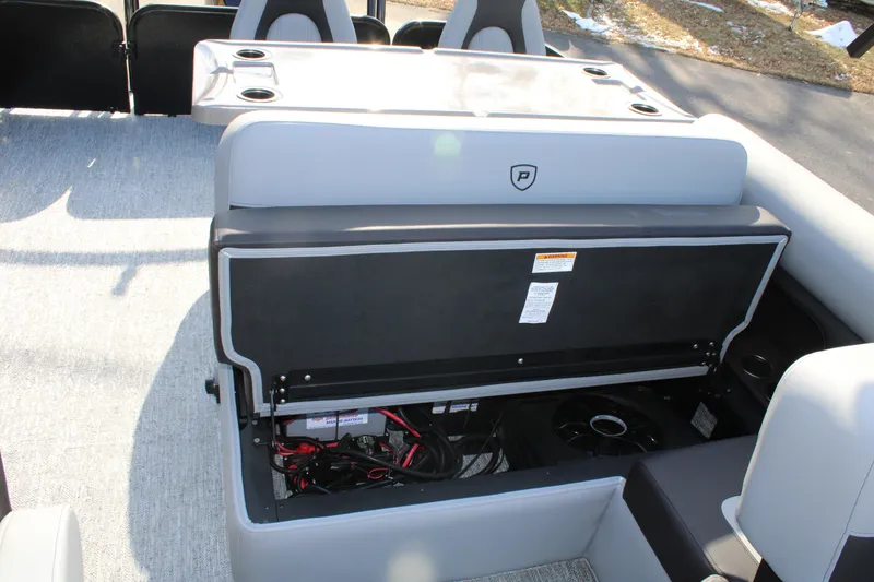 Slide: The Image of 2026 Premier 230 Sunsation RS boat interior with open storage compartment. - 14