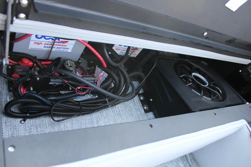 Slide: The Image of 2026 Premier 230 Sunsation RS PTX 28 marine battery and wiring compartment. - 15