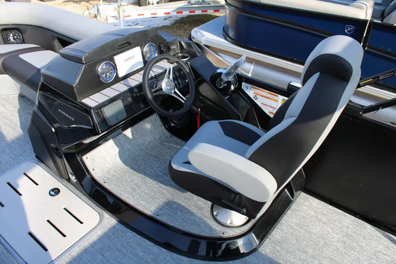 Slide: The Image of 2026 Premier 230 Sunsation RS boat cockpit with modern steering and controls. - 8