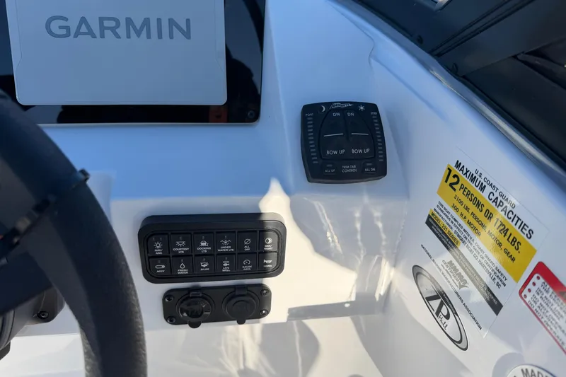 Slide: The Image of 2026 Stingray 231 DC dashboard with Garmin display and control panel. - 17