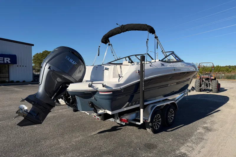 Slide: The Image of 2026 Stingray 231 DC boat with Yamaha outboard motor on a trailer. - 6