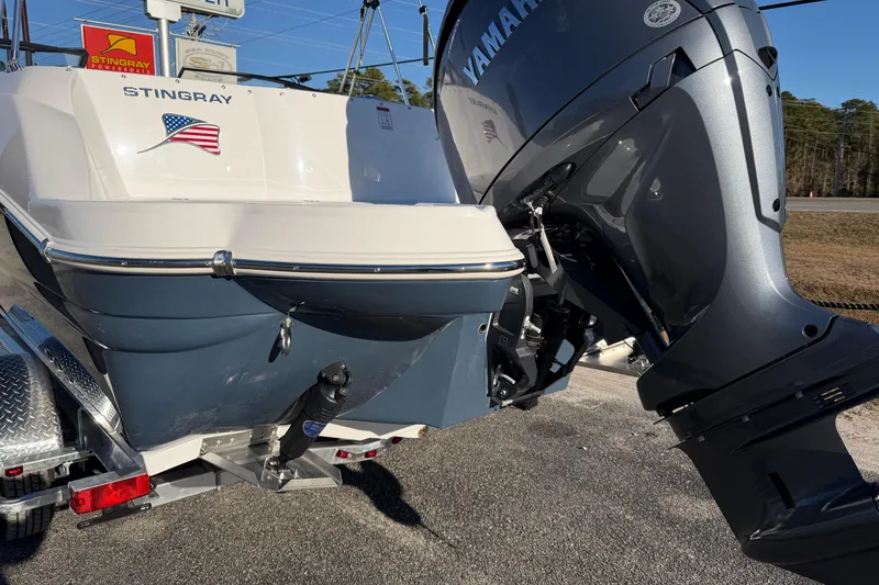 Slide: The Image of 2026 Stingray 231 DC boat with Yamaha outboard motor on trailer. - 9